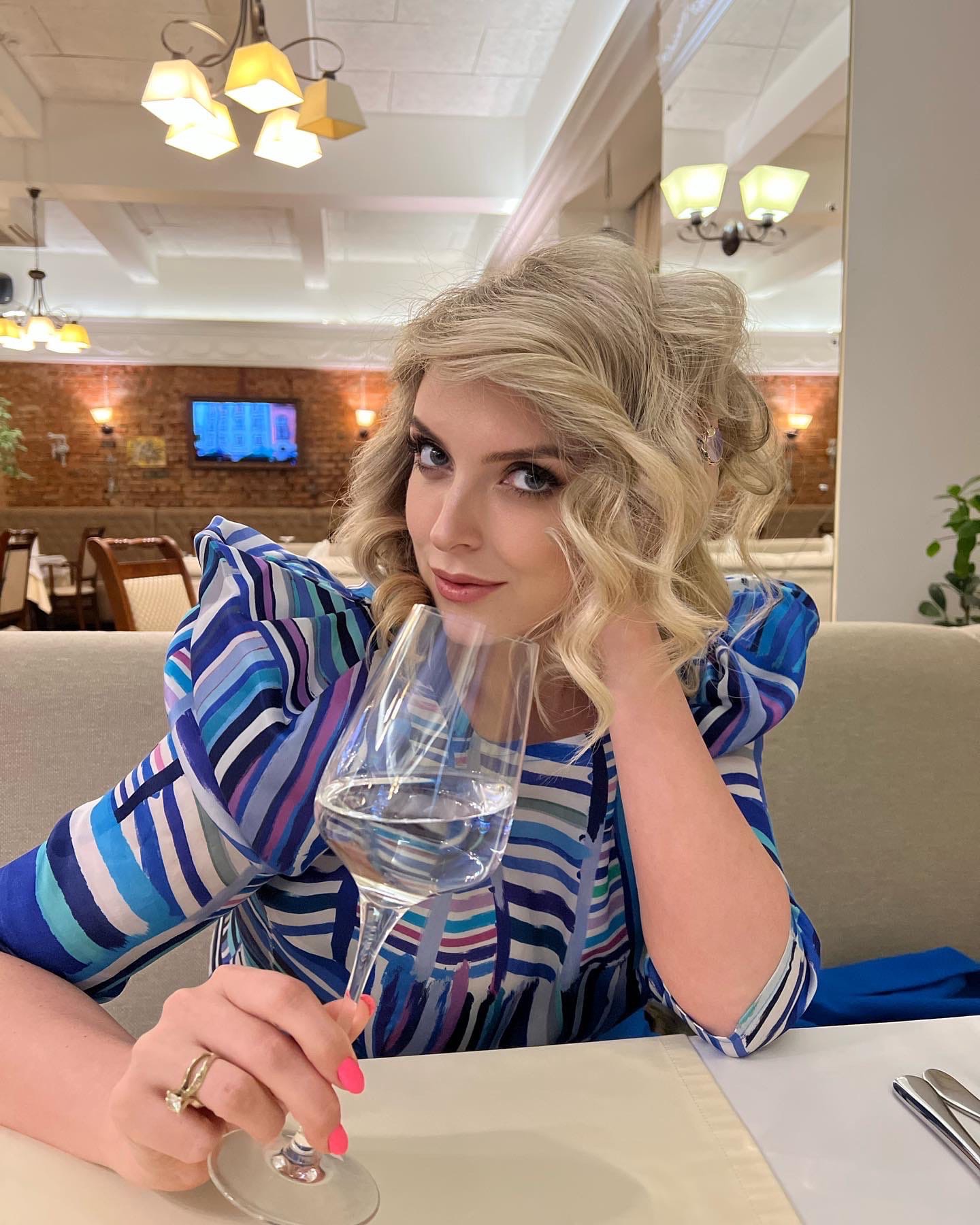 This is a portrait image with resolution 1440x1800, dominant color gray, approximately 5 main objects, containing 2 people.